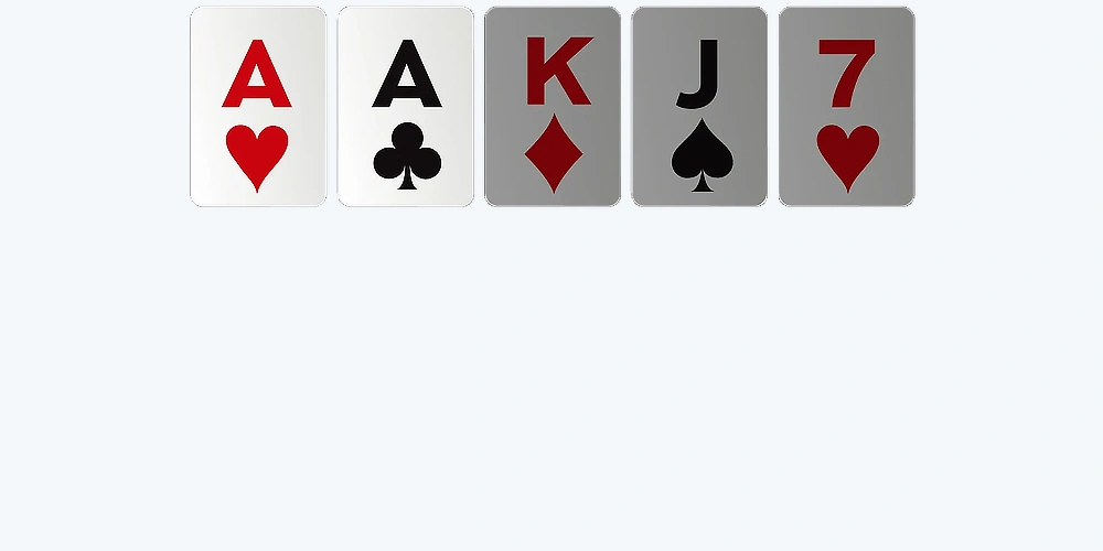 Poker hand one pair example with two aces and mixed cards on table